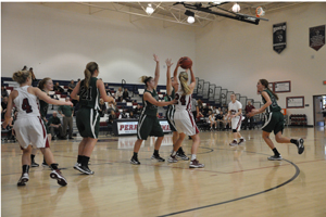 Rachel Amerine tries to pass while defending herself agonist Basha Highs defense.