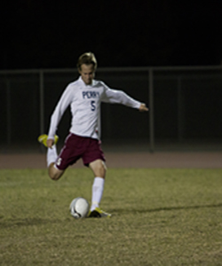 Kade Bishop strikes a free kick from his position as defender 