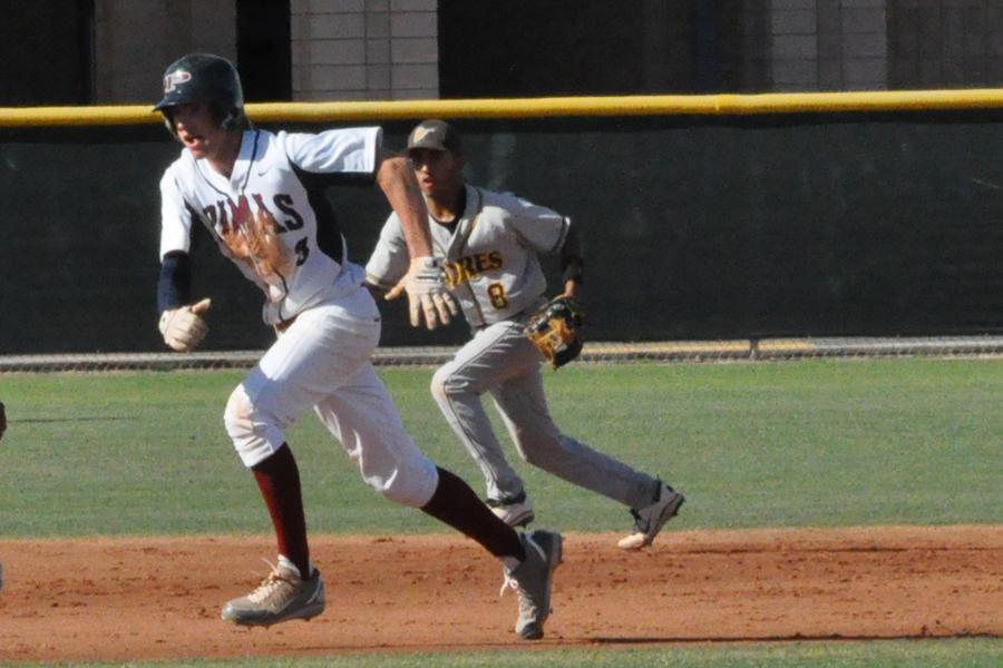 Senior outfielder Dusty Wright scampers to third base in last weeks home game against Marcos de Niza. The Pumas won the game, 7-3.