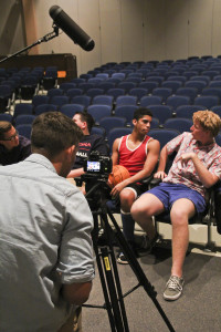 "Perry Prime Time's" Caleb Ragatz films Jordan Howard and Parker Corey's interview in the auditorium.