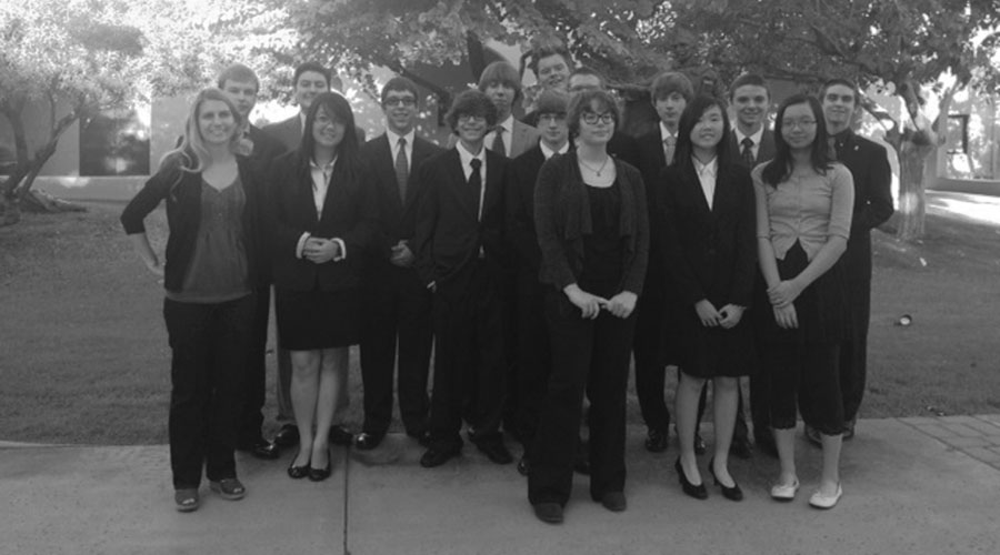 Debate+students+and+advisor+Angela+Buzan+pose+after+a+tournament.+PHS+debate+is+ranked+29+out+of+46+teams+in+the+state.