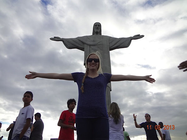 Standing in front of the famous Rio Statue the Christ the Redeemer , Miley Bashford smiles for all to see. She and her family traveled to Brazil for ten weeks during the regular school session. 