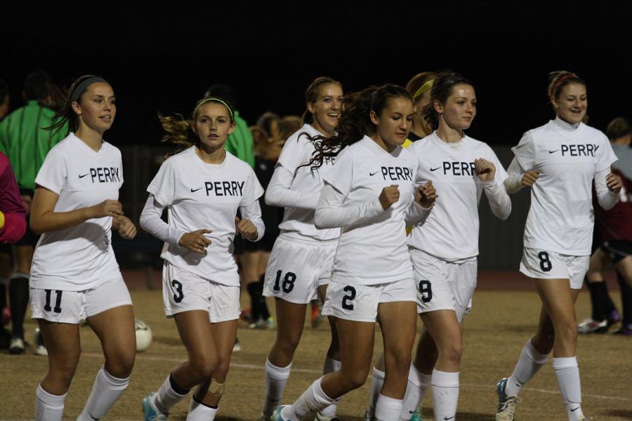 The girls Varsity soccer team get ready to compete at Perry High School and play against Desert Ridge on January 9, 2014.