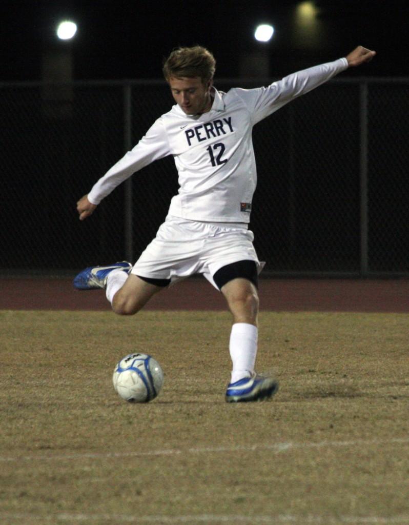 Senior Mitchell Albrecht attempts to clear the ball down the field on Senior Night against Skyline High School.