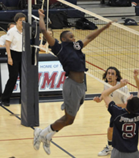 Senior Jalen Cross spikes a ball in a match in late April. Cross, who lead the team in kills with 309, was an intregal part of Perrys team who went 37-8, and solidified itself as a volleyball power. With only four seniors graduating, the Pumas future looks bright.