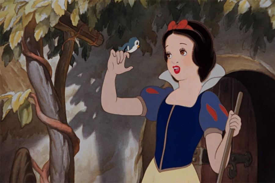 Snow White (voiced by Adriana Caselotti) sings to a bird in a scene from Snow White and the Seven Dwarfs (Disney). 