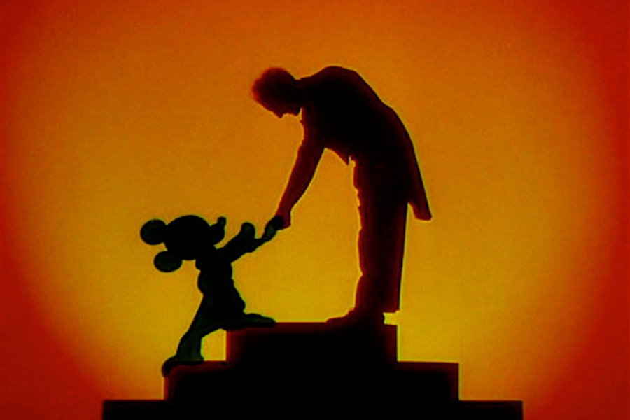 Disney mascot Mickey Mouse shakes hands with conductor Leopold Stokowski (Disney). 
