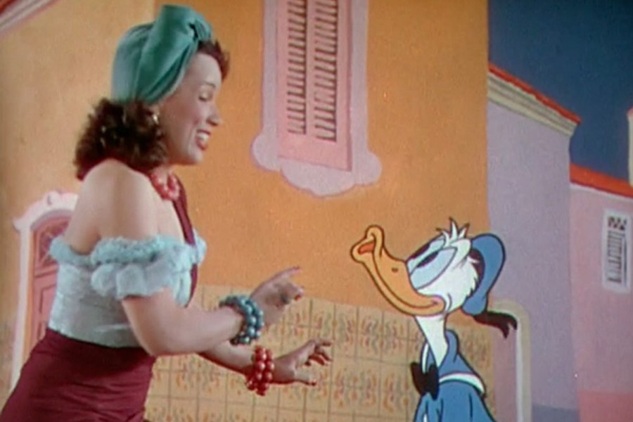 Donald Duck shamelessly flirts with actress and human being Aurora Miranda in a sequence from The Three Caballeros (Disney).  
