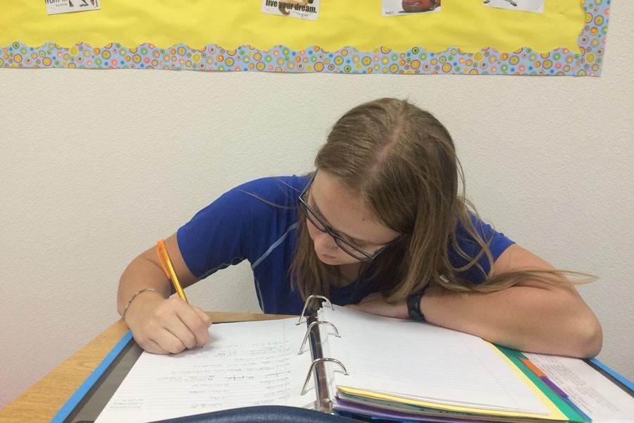 Kirstyn Conroy working in her Calculus BC class. Conroy will be the first STEM scholar early graduate.