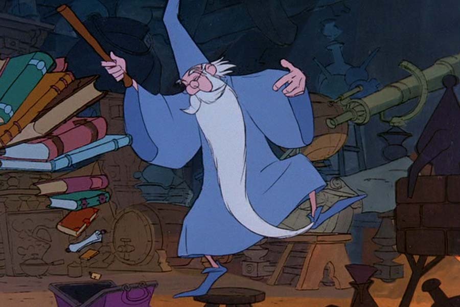 Merlin (voiced by Karl Swenson) packs up his magical tomes to the tune of Higitus Figitus (Disney).