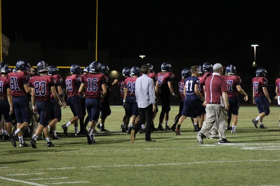 The+varsity+team+takes+the+field+following+the+homecoming+game+against+Chaparral.+