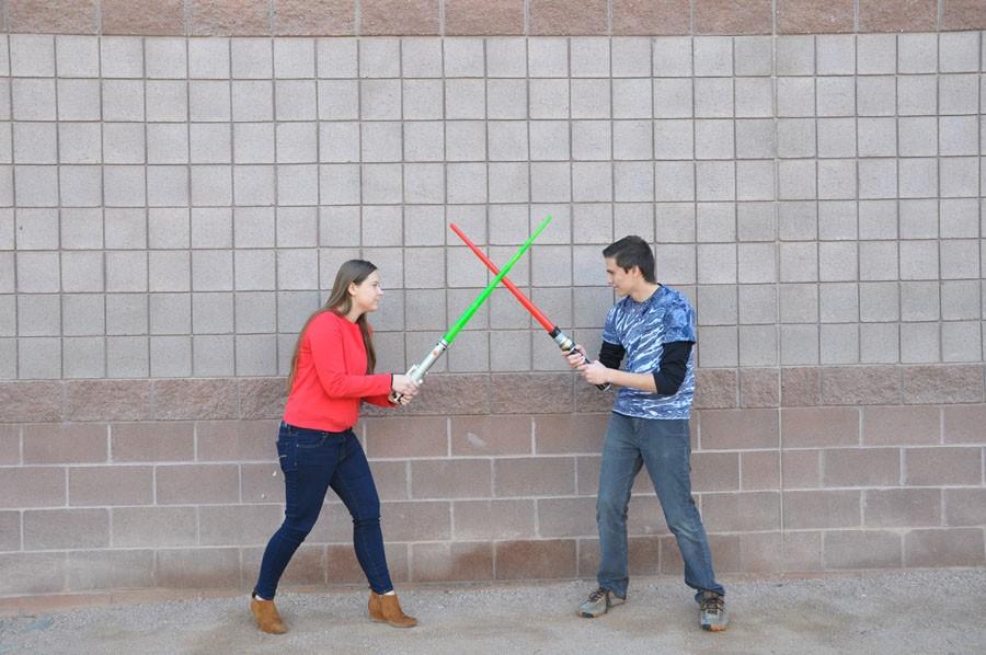 Staff reporters Kylie Vacala on left and Lucas Smith on right face off Star Wars style. 