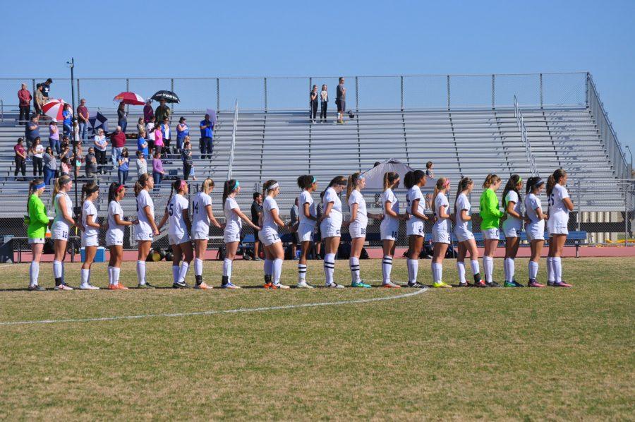 Girls+Soccer+in+line+for+the+National+Anthem.+Girls+Soccer+played+in+the+Quarterfinal+game+against+Chandler+on+February+4%2C+2017.
