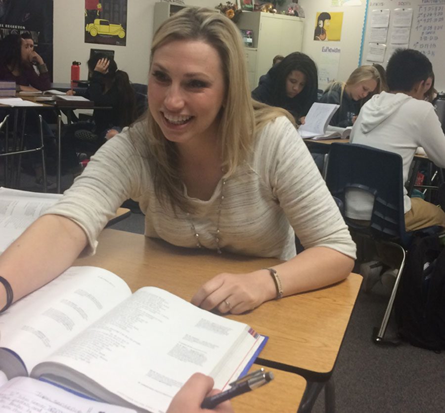 English teacher Katie Dorris explains a concept from Julius Caesar to one of her sophomore students.