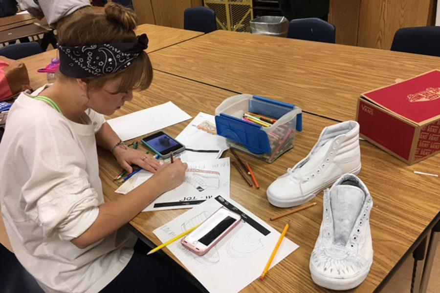 Sasha Rodriguez sketching out her shoe design.