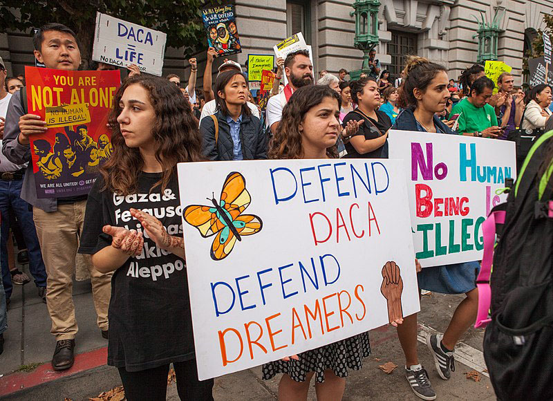 Protesters holding up signs in a San Fransisco rally on Sept. 5 2017