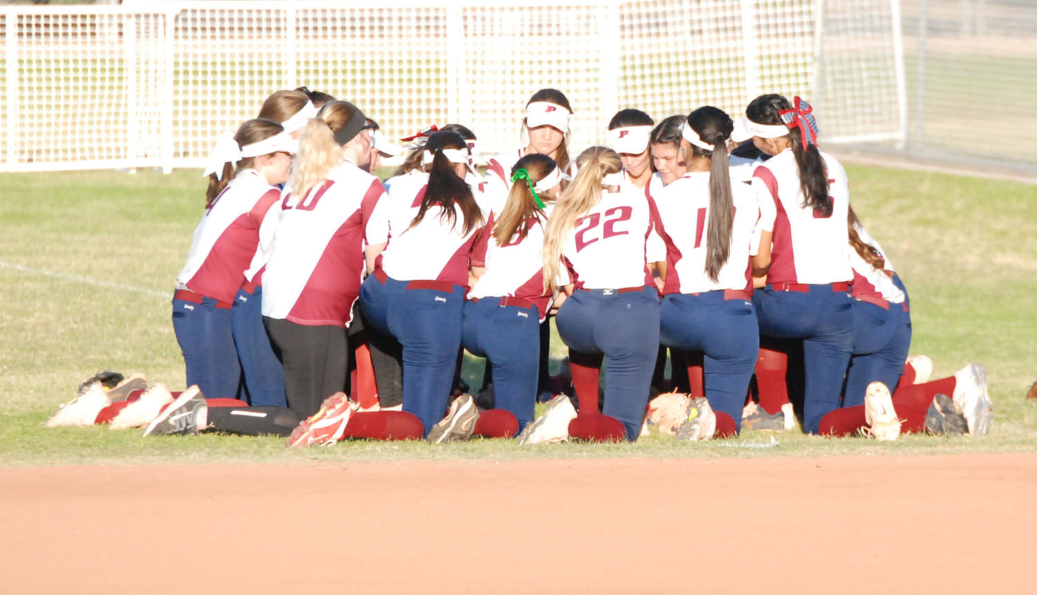 Perry Softball works as a unit to achieve their goals.