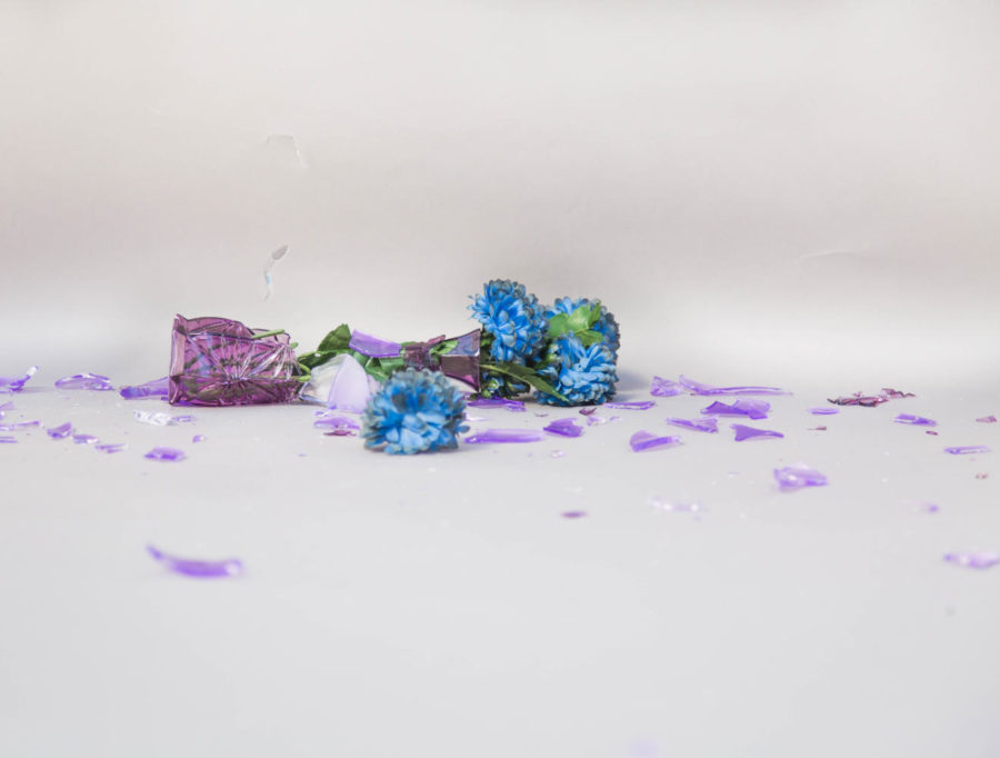 A broken glass symbolizes the ripple-effect each suicide has on a community.