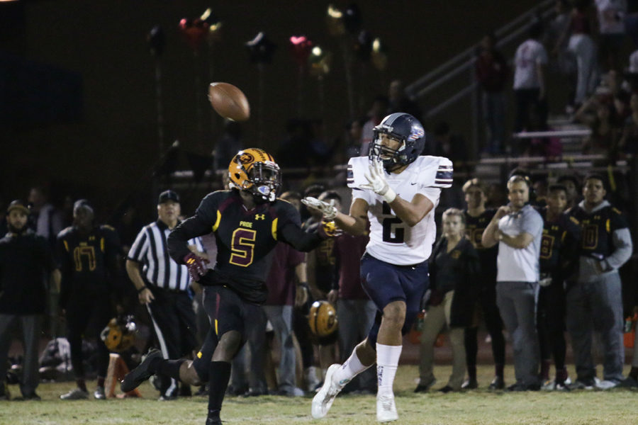 Junior DShayne James catches a pass in Perrys 56-31 semifinal win over No. 1 Mountain Pointe.
