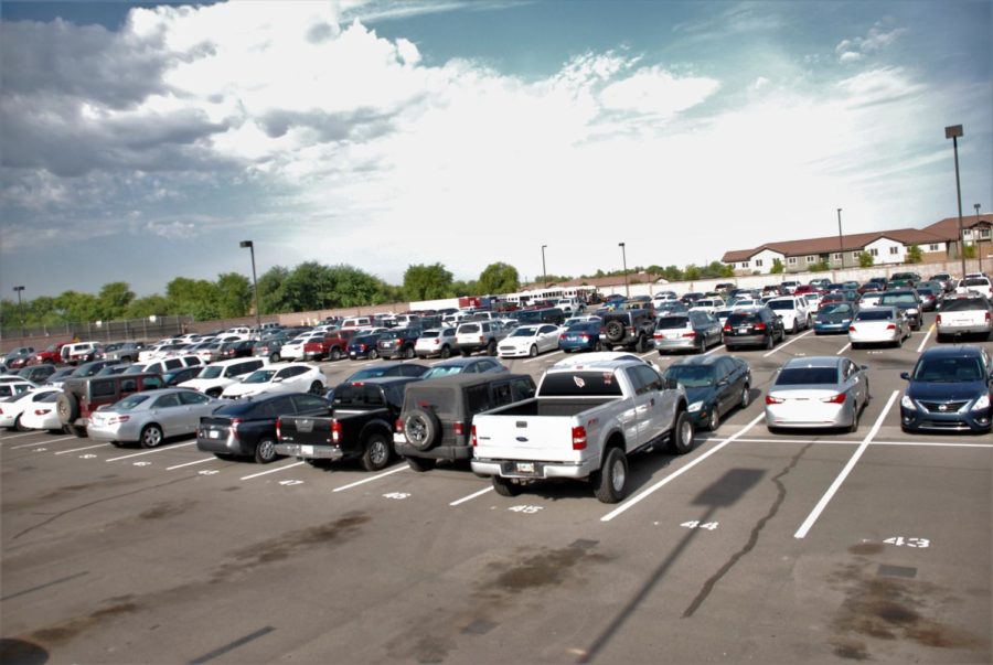 The lot is filled with student cars at the beginning of the school day. Most of the cars belong to the senior students. 