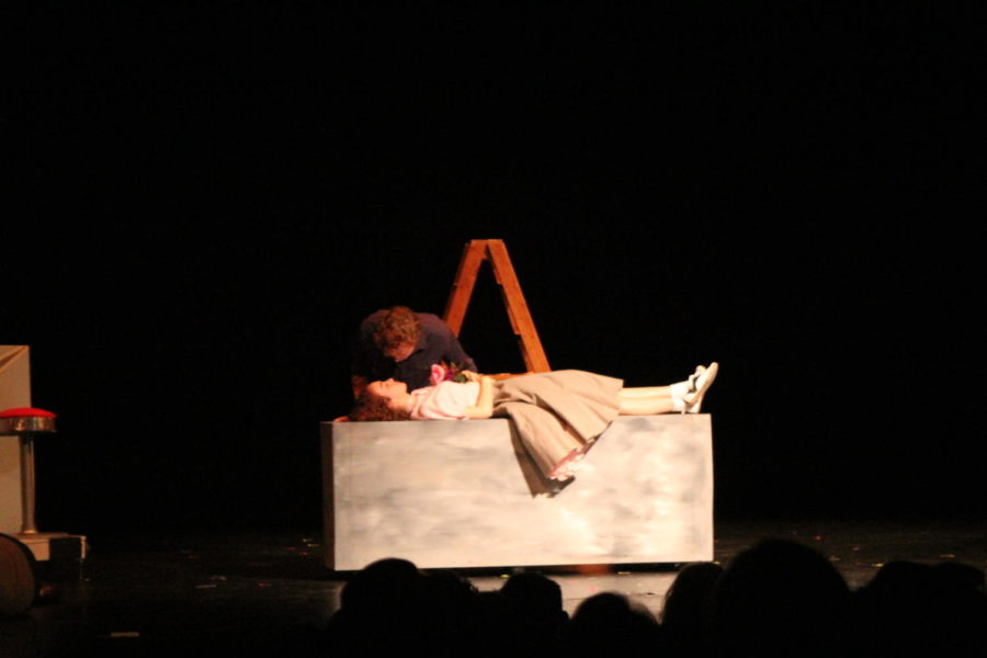 Romeo and Juliet performing the scene in which Romeo finds Juliet unconscious and mourns for her.