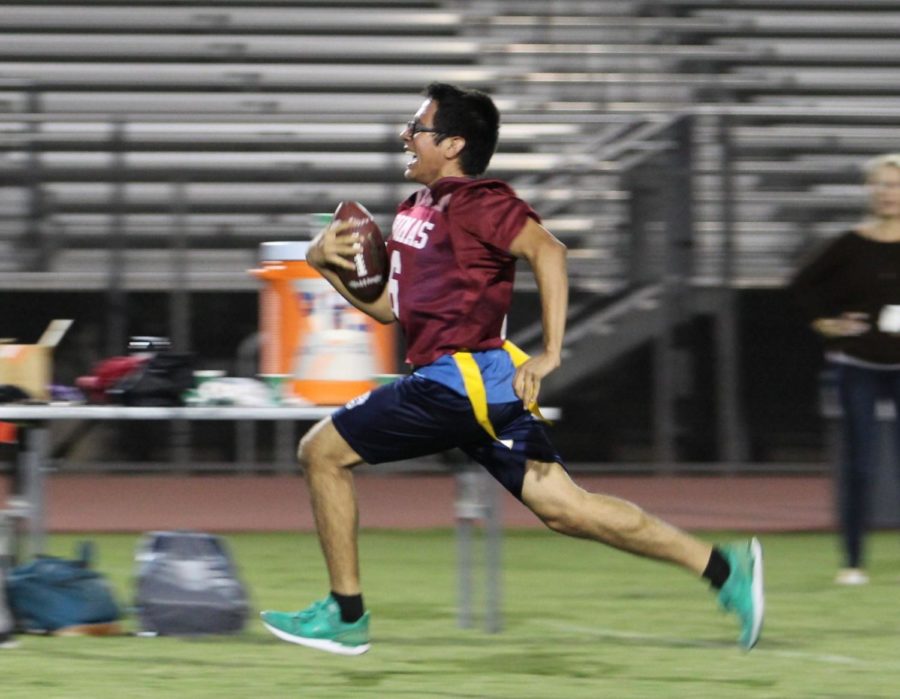 Senior David Salano carries the ball for a touchdown