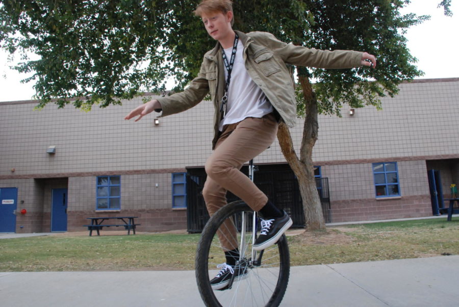 Student Matthew McGrath riding his unicycle.
