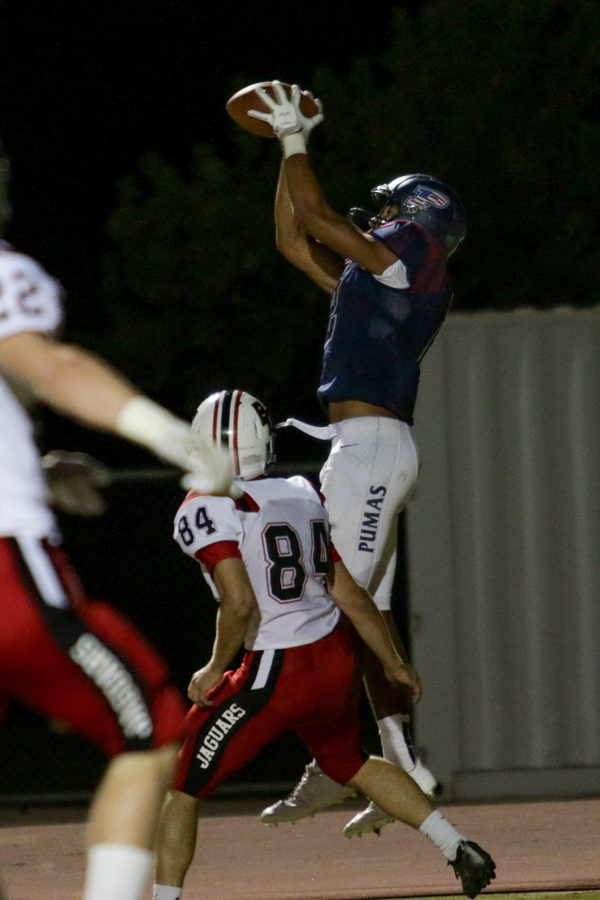Wide receiver DShayne James catches a pass for a touchdown against Boulder Creek in 2017. James was poised to split time as quarterback and wide receiver before suffering a knee injury before the start of his senior year.