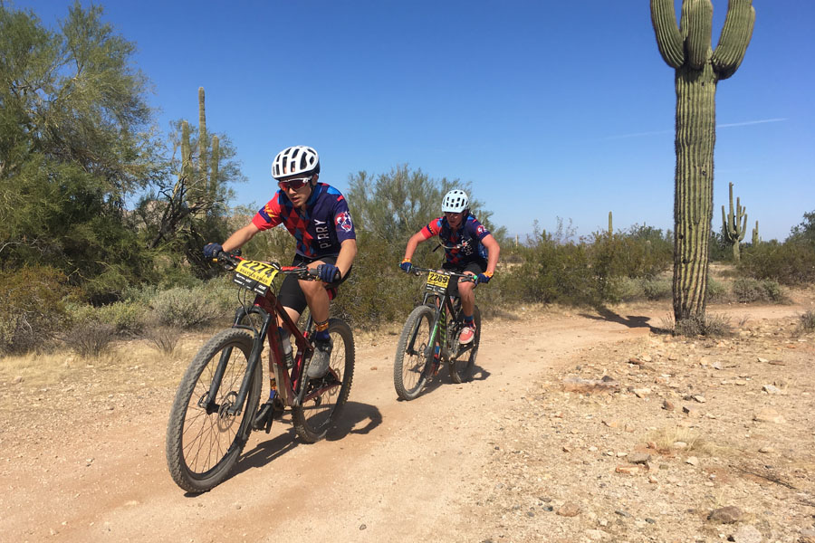Two members of mountain bike club riding at their last race of the reason. The team finished with their second best placement of the season in 16th. 