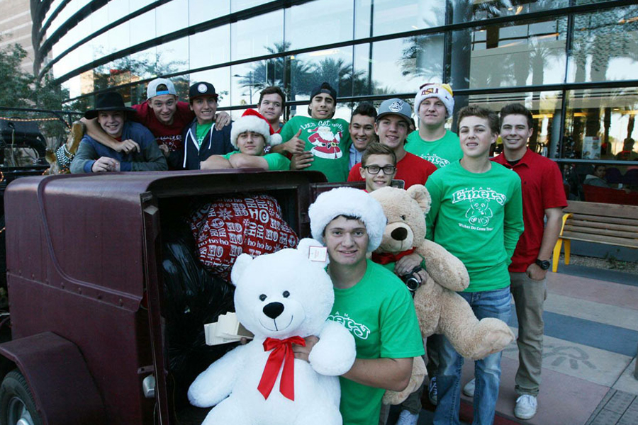 Emery Miller (center) poses with his baseball teammates for the Team Emery teddy bear drive.
