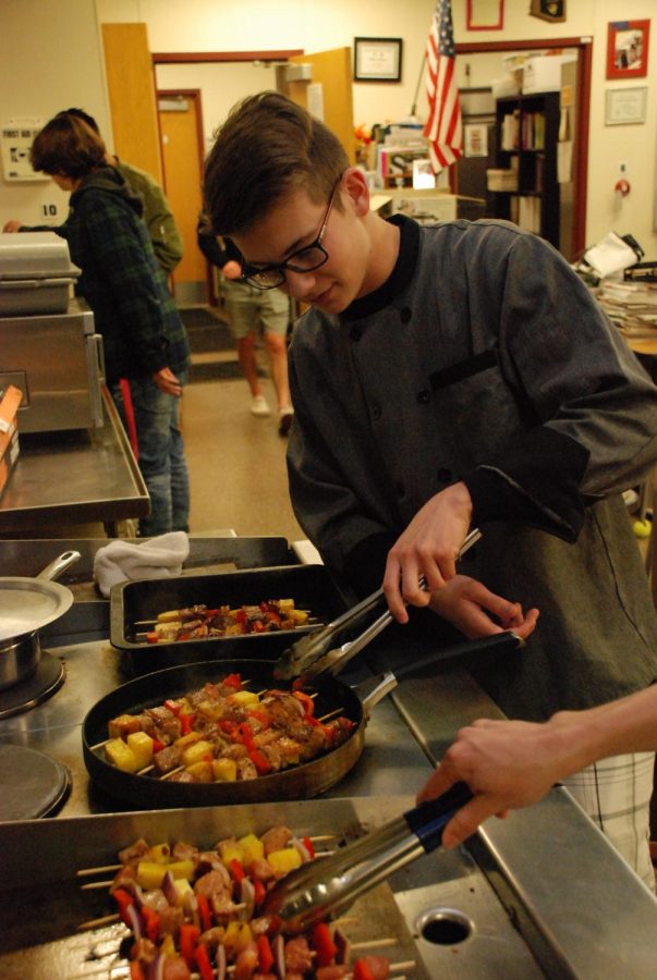 Senior Brandon Park cooks up his latest creation in his fourth hour culinary class with Angela Stutz.