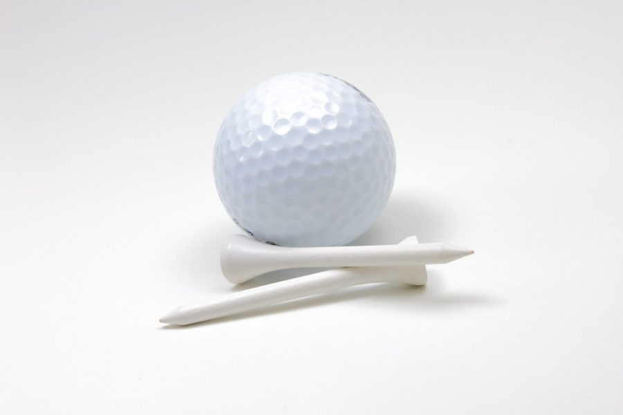 Golf ball and two tees.