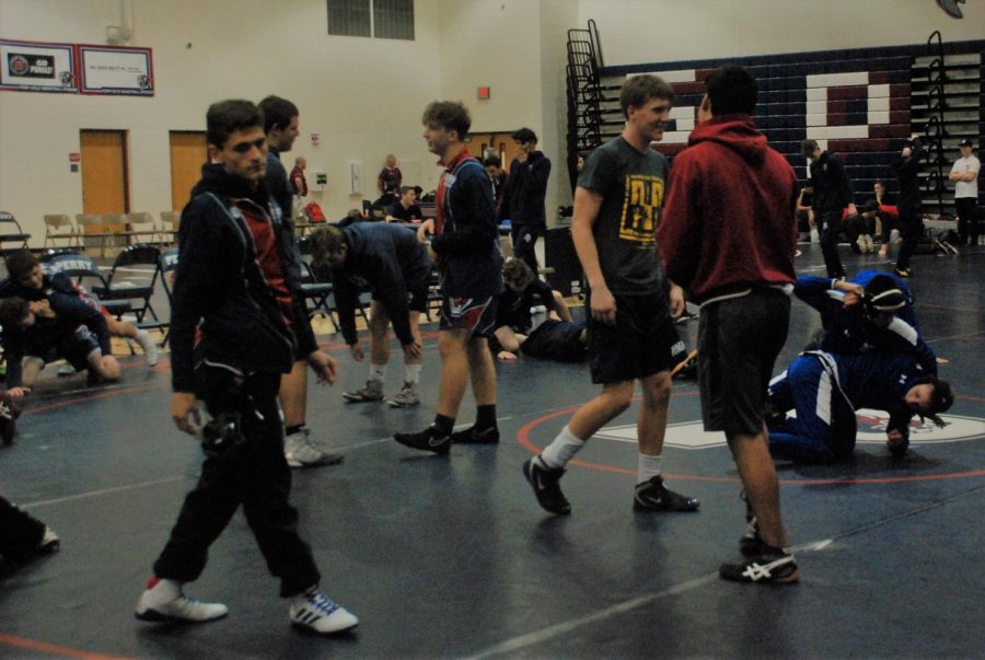 Perry wrestling gears up for a meet during the 2019-20 season. Perry wrestling broke several school records during the regular season, including winning sectionals and having several state placers.