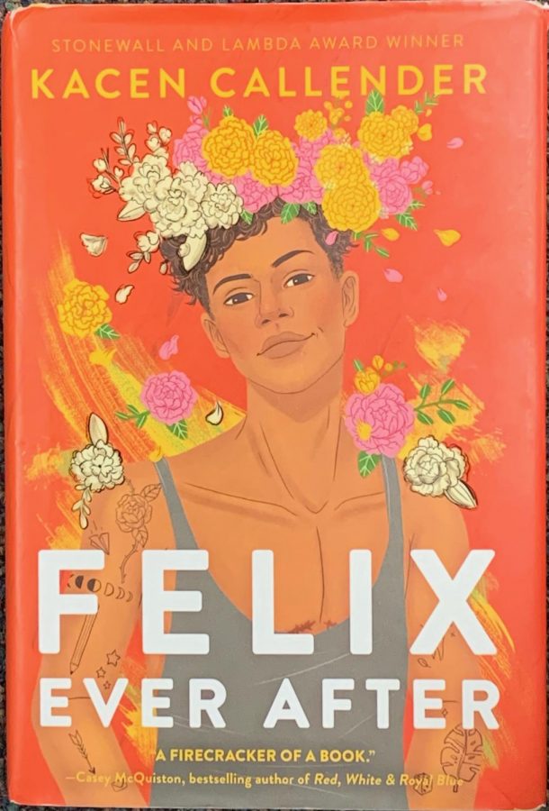 Kacen Callenders novel, Felix Ever After. Felix is wearing a flower crown and a shirt that shows his top surgery scars.