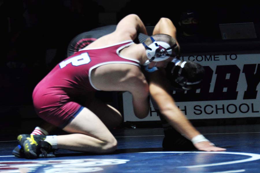 Freshman Wyatt Milnes wrestling against Red Mountain on January 19th. This was Milnes first time wrestling for the team, but even though he is new he was still able to win his match. 