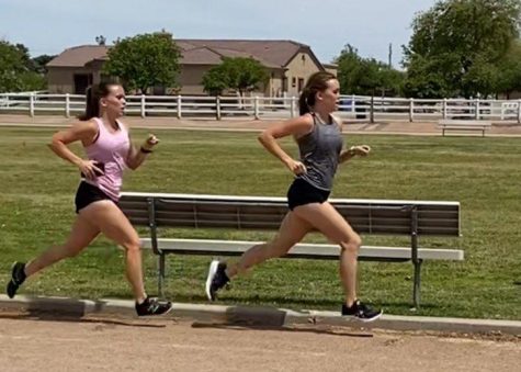 Twins Katie and Kylie Miller run the usual three miles for a track practice after school. The Miller twins have won many awards and have been dedicated to track and field for all four years of highschool