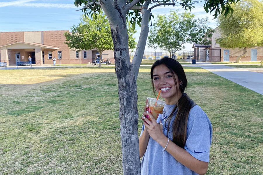 Senior Taylor Carrillo drinks the famous Dunkin Donuts drink The Charli. 
