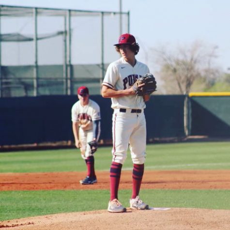  Senior baseball player Stephen Hernandez prepares to pitch during a home game. Hernandez finished last season with a 5.25 Earned Run Average (ERA), which is the number of runs the pitcher allows every nine innings. 
