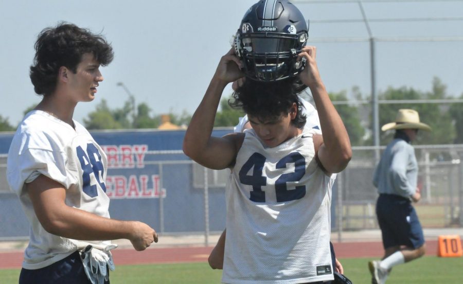 Senior Mason Mesias ends practice early before gameday. Football has their locker class 6th hour where they will usually discuss previous games or get in extra practice which flows into the hours they spend practicing after school.