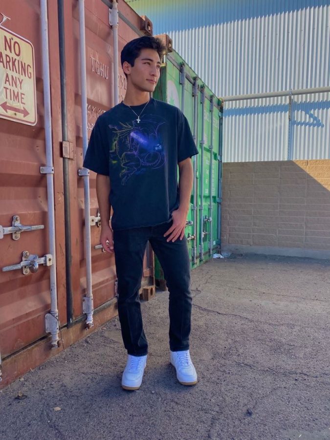 Junior Evan Sideris wears one of Watsons shirts for the most recent drop. Watson takes photos of her models to post for each drop to showcase her products. 