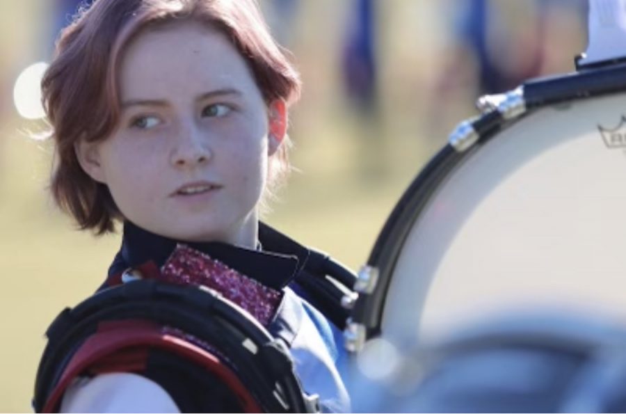 Lucy Salanga drums during a rehearsal for a football game. Practicing is a very crucial part of band consisting of at least two practices a day. 
