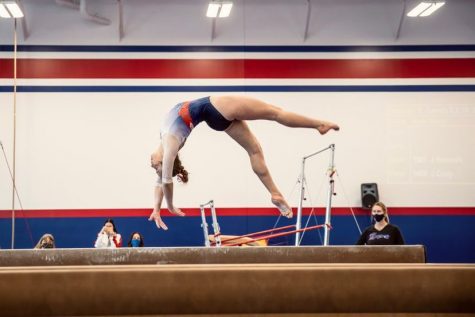 Senior gymnast Avery Bibbey practices her beam routine at gym every day. Bibbey is a level 10 at USA Illusions and has been doing gymnastics her whole life. 