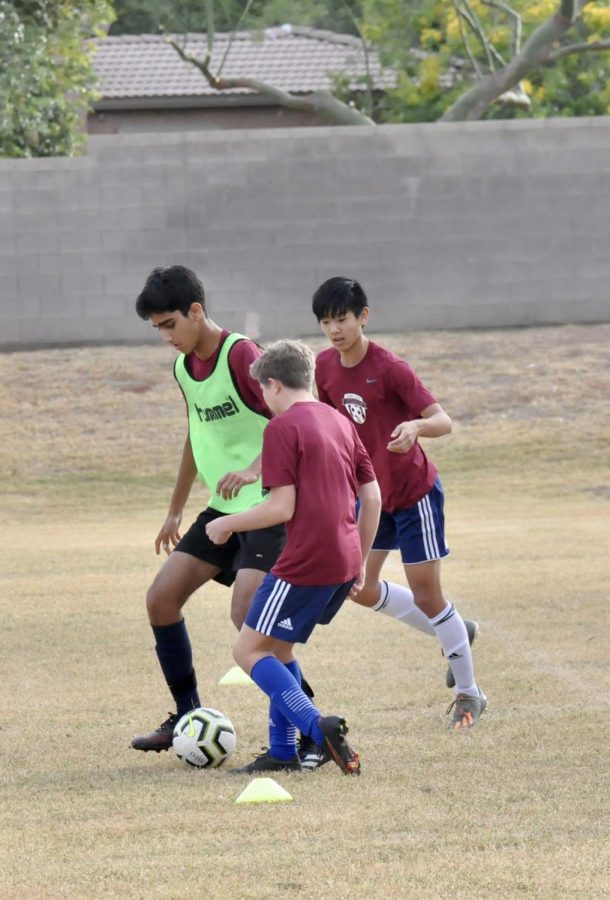 Sophomore Ronak Bhatia practicing in the Pit on Friday Dec.10. Bhatia is a part of junior varsity soccer team, working towards playing on varsity. 