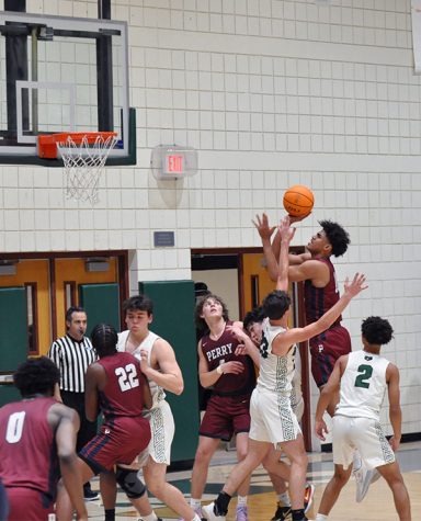 Freshman Koa Peat attempts to score for the pumas at the game against Basha. The pumas won 66-47 to add on to their 9-game winstreak at the time.