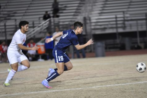 Senior Hayden Clinton beats a defender in a game versus North High on January 11. Clinton went on to score and help the pumas win the game 4-0. 