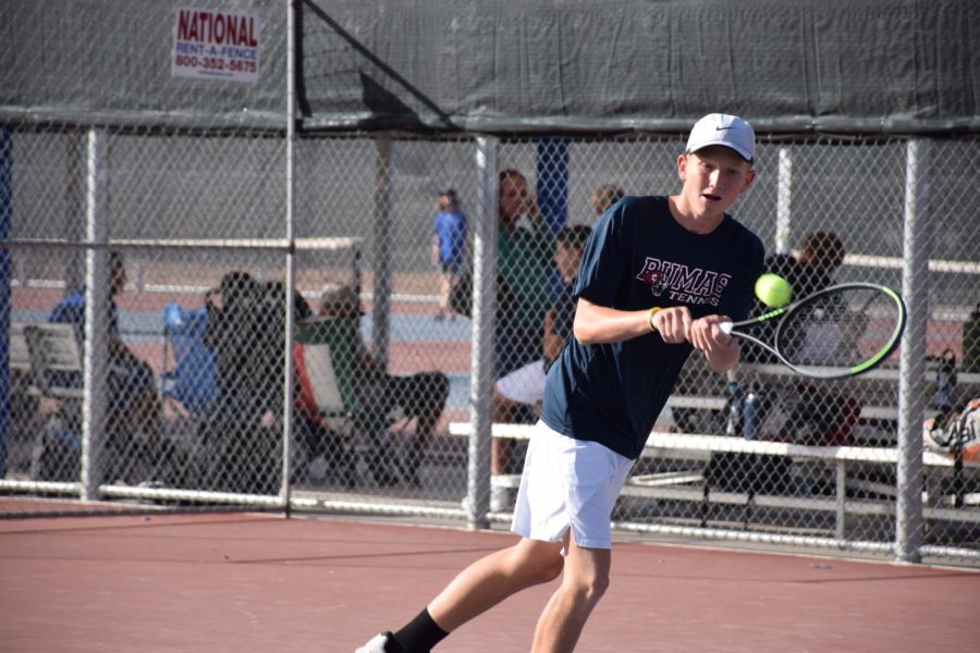 Freshman Dallin Welch practicing for tennis season. Matches began on Feb 23.