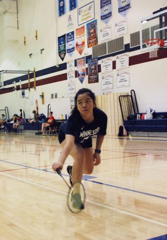 Senior Oanh Le lunges towards the birdie ready to send it back to her opponent. Badminton won the past five years so there is added stress for seniors this year hoping to earn another state title. 
