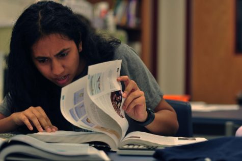 Senior Joyce Gunaraj works on AP Stat homework, amongst the other obligations of a senior. Many students may feel overwhelmed going back to school, and can use the Wellness Room as a resource. 