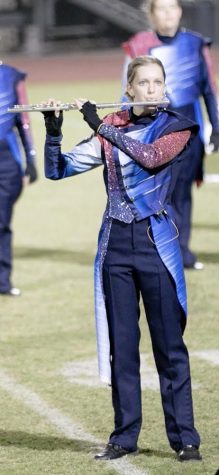Junior Kelsie Lyle plays the flute for marching band. October 22, at the Perry competition