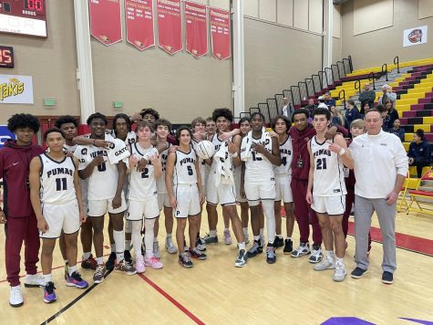 Post game team photo after Perry’s win over Cardinal Hayes, a New York team, at Hoophall West. The final score was 78 to 47. 